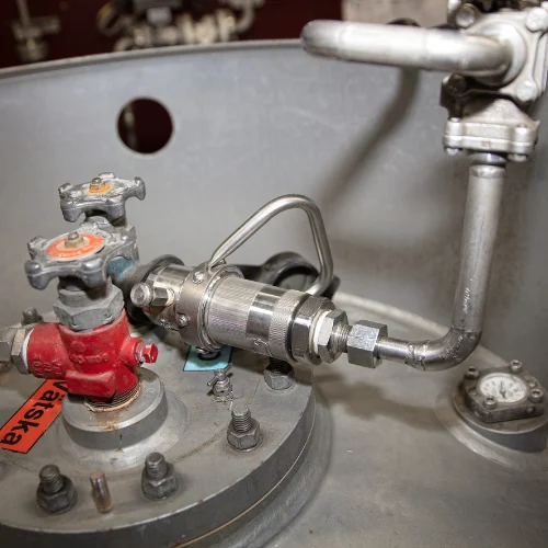 A Dry Disconnect Hose Unit connected to a barrel