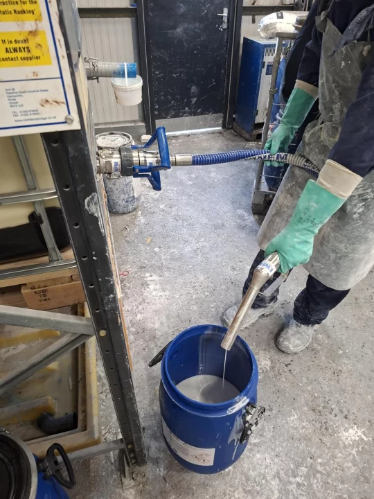 Customer photo of a fully integrated transfer system consisting of a 1" Manual Delivery Nozzle with a 1.5″ Bore Composite Hose and 2" Dry Disconnect Coupling.