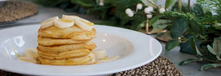 Pancakes with banana and syrup