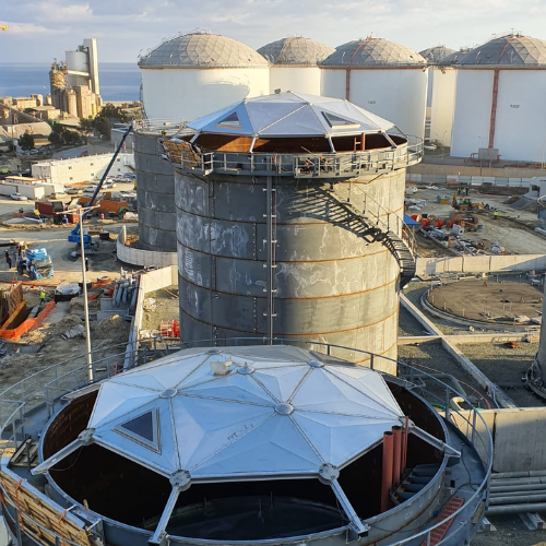 Two Geodesic Domes on Storage Tanks