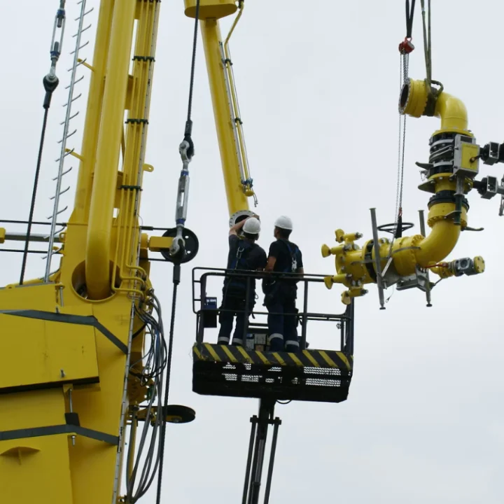 Two Engineers conducting a thorough inspection on a Marine Loading Arm