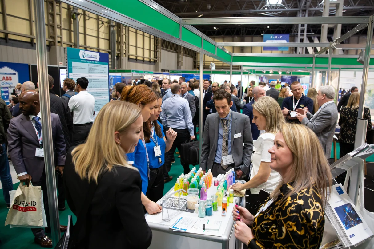 Visitors gathering around stands at ChemUK 2023