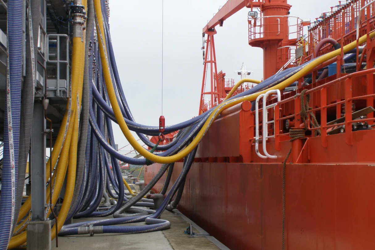 Hose being used to transfer media to a ship